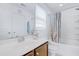Bathroom featuring a shower-tub combo, white vanity, and a large mirror at 714 Cupola Dr, Raleigh, NC 27603
