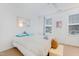 Bright bedroom with a light striped bedspread, decorative pillows and a full size bed at 714 Cupola Dr, Raleigh, NC 27603