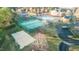 Overhead view of a community featuring tennis and volleyball courts near a building with a swimming pool at 714 Cupola Dr, Raleigh, NC 27603