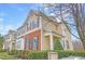A well-kept multi-story townhome with a mix of vinyl siding and brick, topped with black shutters at 714 Cupola Dr, Raleigh, NC 27603