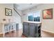 Kitchen island with seating area, and large sliding glass door to the backyard at 714 Cupola Dr, Raleigh, NC 27603