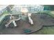 Elevated shot of playground area featuring slides and swings, near tennis courts at 714 Cupola Dr, Raleigh, NC 27603