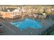 An aerial shot of a stunning blue swimming pool at a brick residential complex on a sunny day at 714 Cupola Dr, Raleigh, NC 27603