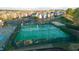 Overhead shot of community tennis courts next to parking and a swimming pool in a residential area at 714 Cupola Dr, Raleigh, NC 27603