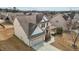 An aerial view shows this two-story home sits in a neighborhood with well-maintained lawns at 714 Fairway Dr, Mebane, NC 27302