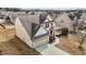 An aerial view shows this two-story home sits in a neighborhood with well-maintained lawns at 714 Fairway Dr, Mebane, NC 27302