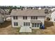 A bird's-eye view reveals a two-story residence complete with a concrete patio and a well-manicured yard at 714 Fairway Dr, Mebane, NC 27302