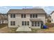 Back of house showing two stories, well kept yard and a concrete patio area at 714 Fairway Dr, Mebane, NC 27302