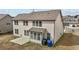 Back of house showing two stories, well kept yard and a concrete patio area at 714 Fairway Dr, Mebane, NC 27302