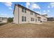 Large backyard featuring a well-maintained lawn and the home's siding with numerous windows at 714 Fairway Dr, Mebane, NC 27302