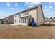 Exterior rear view of the home highlighting the backyard and siding with multiple windows at 714 Fairway Dr, Mebane, NC 27302