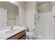 Bright bathroom featuring a stand-up shower with grab bar and accessible features at 714 Fairway Dr, Mebane, NC 27302