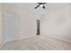 Neutral bedroom featuring carpet flooring, a ceiling fan, and a doorway to another room at 714 Fairway Dr, Mebane, NC 27302