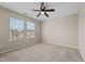 Bright bedroom featuring a ceiling fan and carpeted floors at 714 Fairway Dr, Mebane, NC 27302