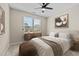 Inviting bedroom with a ceiling fan, ample natural light and neutral color palette at 714 Fairway Dr, Mebane, NC 27302