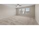 Cozy bedroom featuring large windows that let in plenty of natural light at 714 Fairway Dr, Mebane, NC 27302