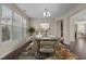 This dining area is filled with natural light, lovely decor and is ready for entertaining at 714 Fairway Dr, Mebane, NC 27302
