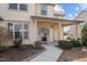 Inviting front porch with classic columns and well-maintained landscaping leads to the home's entrance at 714 Fairway Dr, Mebane, NC 27302