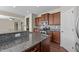 Well-equipped kitchen features granite countertops, stainless steel appliances, and ample cabinet space at 714 Fairway Dr, Mebane, NC 27302