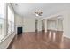 Open-concept area featuring hardwood floors, fireplace, and an entry view at 714 Fairway Dr, Mebane, NC 27302