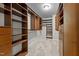 Walk-in closet with custom built-in shelving and drawers at 714 Fairway Dr, Mebane, NC 27302