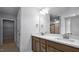 Modern bathroom featuring double sinks and wood cabinets at 7521 Percussion Dr, Apex, NC 27539