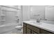 Clean bathroom featuring a shower-tub combo and vanity with light countertops at 7521 Percussion Dr, Apex, NC 27539