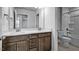 Bathroom with double sink vanity, quartz counters, modern fixtures, toilet and tiled shower-tub combo at 7521 Percussion Dr, Apex, NC 27539