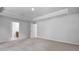 Large carpeted bedroom with attached bathroom at 7521 Percussion Dr, Apex, NC 27539