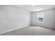 Bedroom with neutral carpeting and natural light from window, creating a serene and cozy atmosphere at 7521 Percussion Dr, Apex, NC 27539