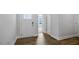 Bright entryway with wood flooring and white trim, leading to other rooms in the house at 7521 Percussion Dr, Apex, NC 27539