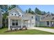 Charming two-story home with a welcoming front porch and well-manicured lawn at 7521 Percussion Dr, Apex, NC 27539