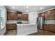 Well-equipped kitchen with a large island and stainless steel appliances at 7521 Percussion Dr, Apex, NC 27539