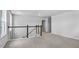 Spacious loft area with natural light and neutral carpeting at 7521 Percussion Dr, Apex, NC 27539