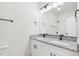 This bathroom has granite countertops, a double sink, a mirror, and dark hardware at 815 Graham St, Burlington, NC 27217