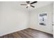 This bedroom features wood floors, natural light from the window, and a ceiling fan at 815 Graham St, Burlington, NC 27217