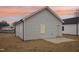 Charming home with gray siding, concrete patio, and attractive landscaping at 815 Graham St, Burlington, NC 27217