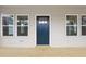 Inviting porch with stylish front door flanked by large windows, showcasing modern design at 815 Graham St, Burlington, NC 27217