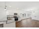 Well-lit kitchen boasts stainless appliances, white cabinets, and granite countertops at 815 Graham St, Burlington, NC 27217