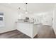 Modern kitchen boasts white cabinets, gray granite counters and stainless appliances at 815 Graham St, Burlington, NC 27217
