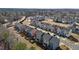 An aerial view showcases modern townhomes with private back patios in a well-maintained community at 905 Arnold Place Dr, Fuquay Varina, NC 27526
