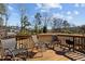 Backyard deck featuring patio furniture with chairs and a grill, perfect for outdoor entertainment at 905 Arnold Place Dr, Fuquay Varina, NC 27526