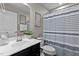 Well-lit bathroom with single vanity and large mirror at 905 Arnold Place Dr, Fuquay Varina, NC 27526