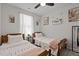 Bedroom with two twin beds and floral decor at 905 Arnold Place Dr, Fuquay Varina, NC 27526