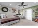 Bright bedroom showcasing a seating area, stylish decor, and ample natural light at 905 Arnold Place Dr, Fuquay Varina, NC 27526