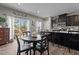 Elegant kitchen with a center island, modern appliances, and adjacent dining space at 905 Arnold Place Dr, Fuquay Varina, NC 27526