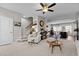 Spacious living room with a staircase, kitchen, dining area, and open floor plan at 905 Arnold Place Dr, Fuquay Varina, NC 27526