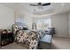 Bright main bedroom with tray ceilings, ceiling fan, and large window for lots of natural light at 905 Arnold Place Dr, Fuquay Varina, NC 27526