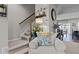Bright chair view of the staircase with wood railings and nearby home decor at 905 Arnold Place Dr, Fuquay Varina, NC 27526