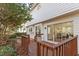 Wooden deck with railing offering a view of the backyard, accessible by sliding glass doors at 105 Solstice Cir, Cary, NC 27513